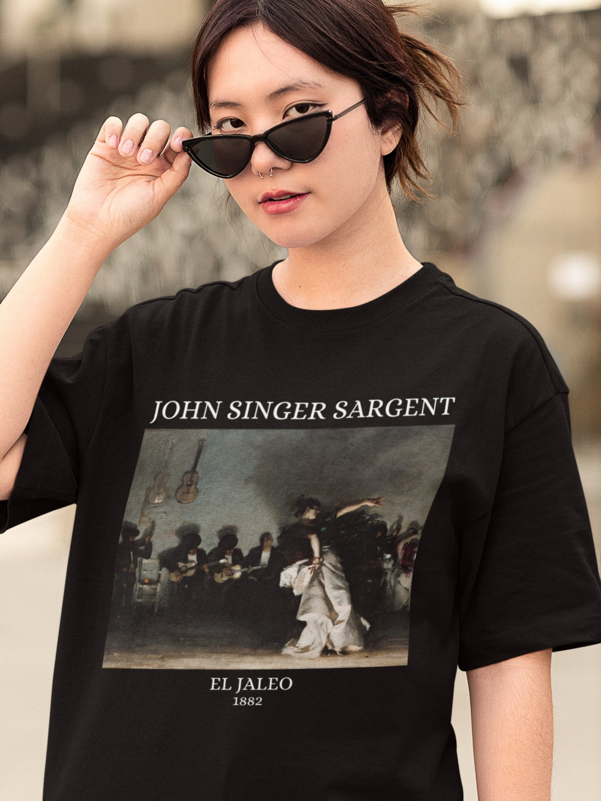 May include: Black t-shirt with a white print of a painting by John Singer Sargent titled "El Jaleo" from 1882.