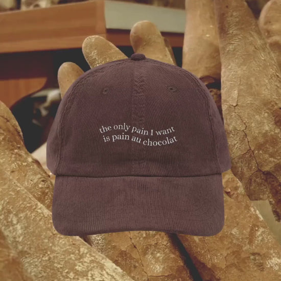 The only pain I want is pain au chocolat embroidered corduroy cap dad hat * Pinterest trendy coquette aesthetic cozy foodie wavy letters